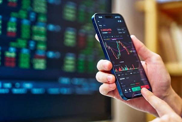 A person analyzing price chart on mobile